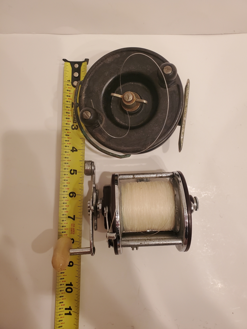 Vintage Two-Piece Fishing Reel Set in Black and Chrome